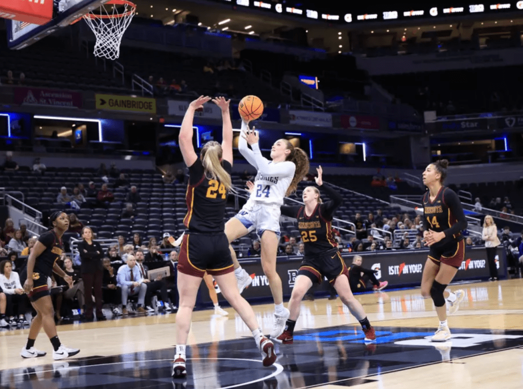 UW guard Elle Ladine shoots a floated shot againest Minnesota in the First Round of the Big Ten Tournament on March 5, 2025 at Gainbridge Fieldhouse in Indianapolis, Ind